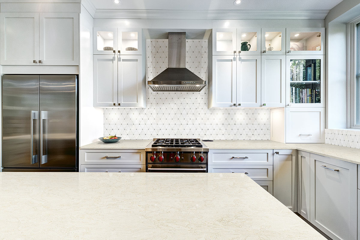 Bianco Dolomite Pinwheel Polished Marble Mosaic Tile backsplash in a kitchen