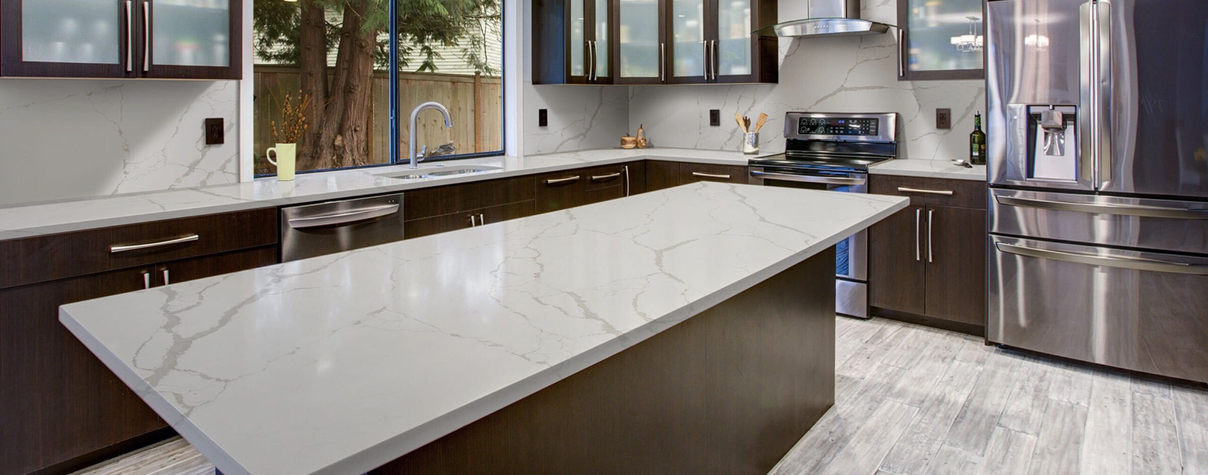 A finished white quartz kitchen after installation