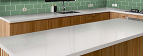 A finished white quartz kitchen after installation