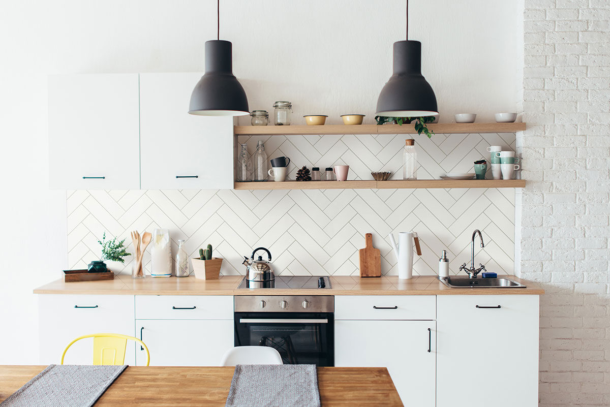 White 2x8 Glossy backsplash installed