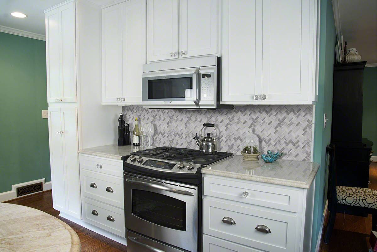 Greecian White Herringbone Pattern backsplash installed — view 3