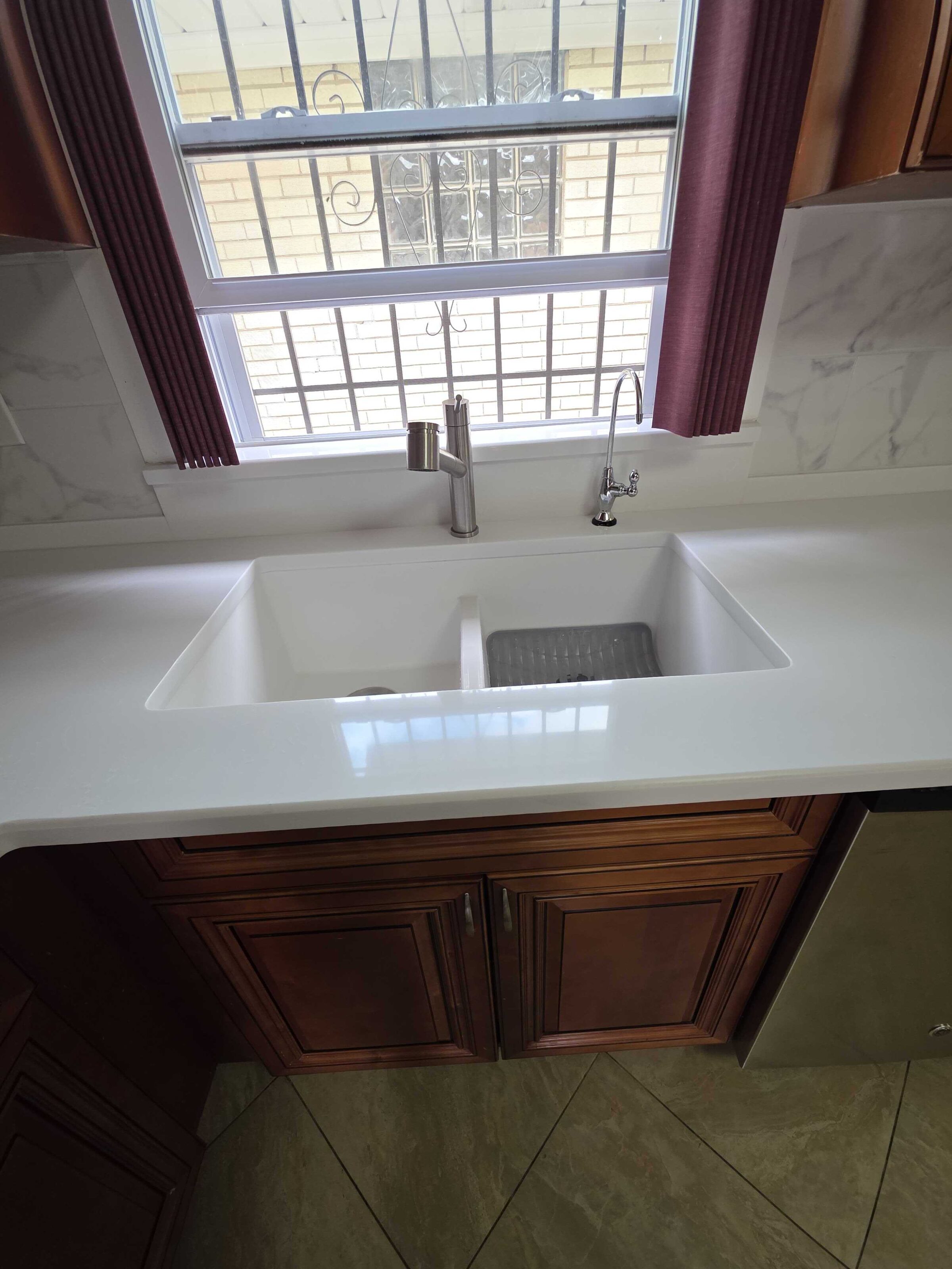 Close view of the new counter and undermount sink at the window