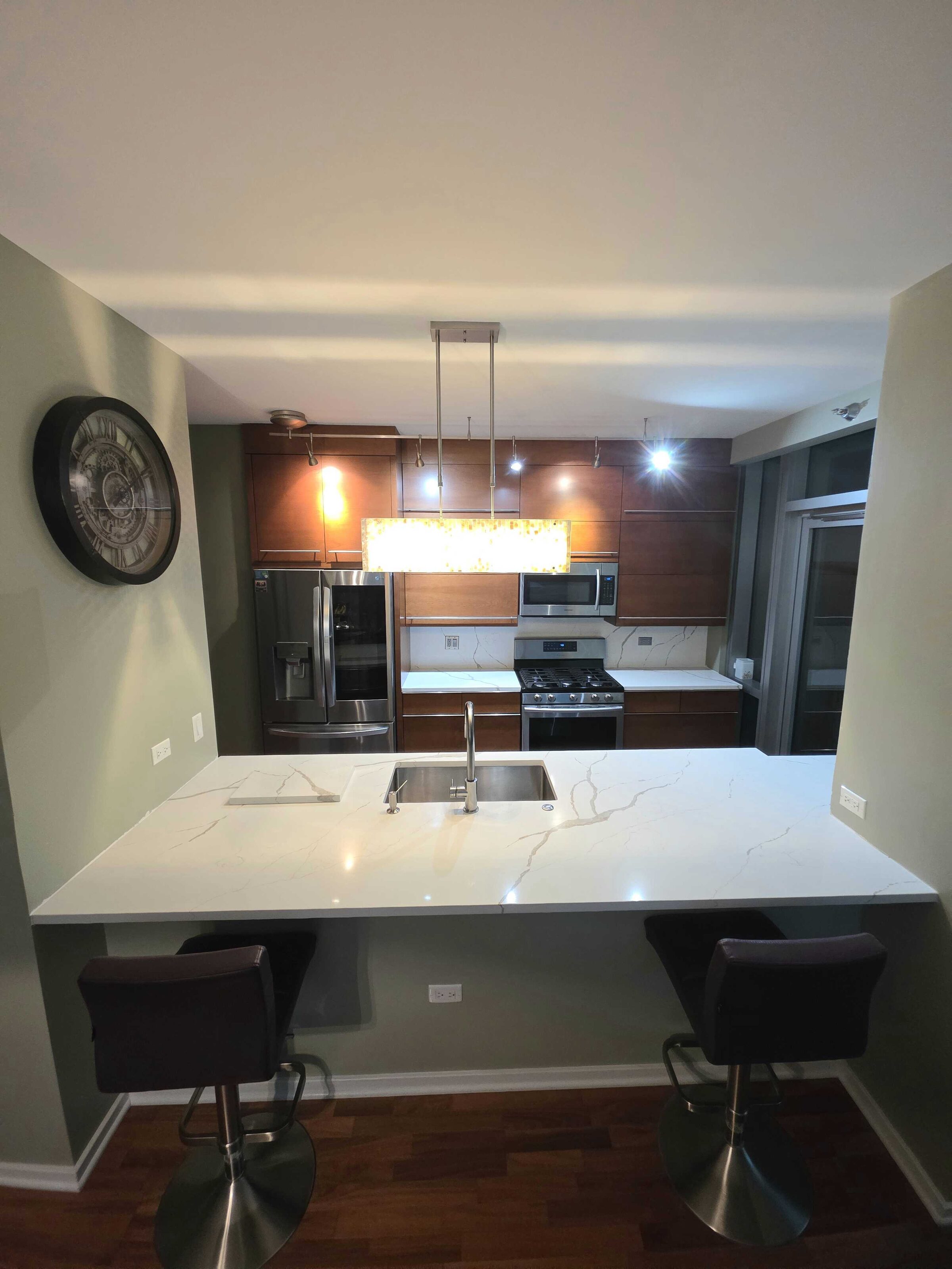 Condo kitchen in calacatta quartz