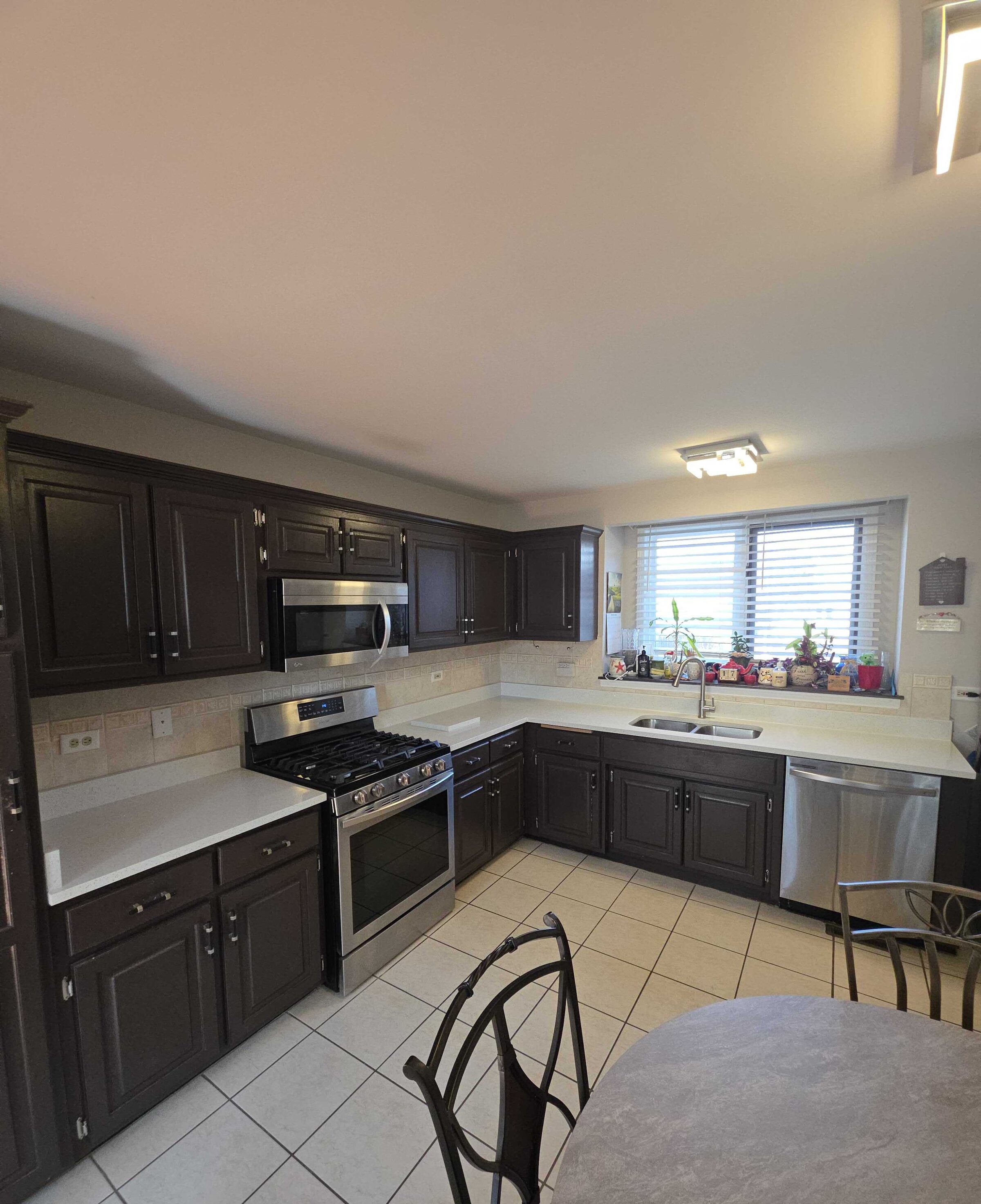 Espresso cabinets, white quartz