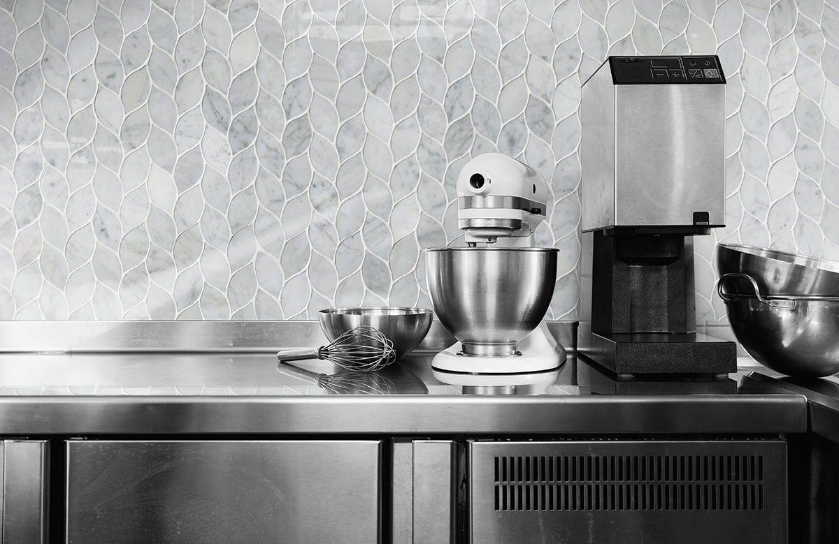 Carrara White Blanco Pattern Honed Tile backsplash installed