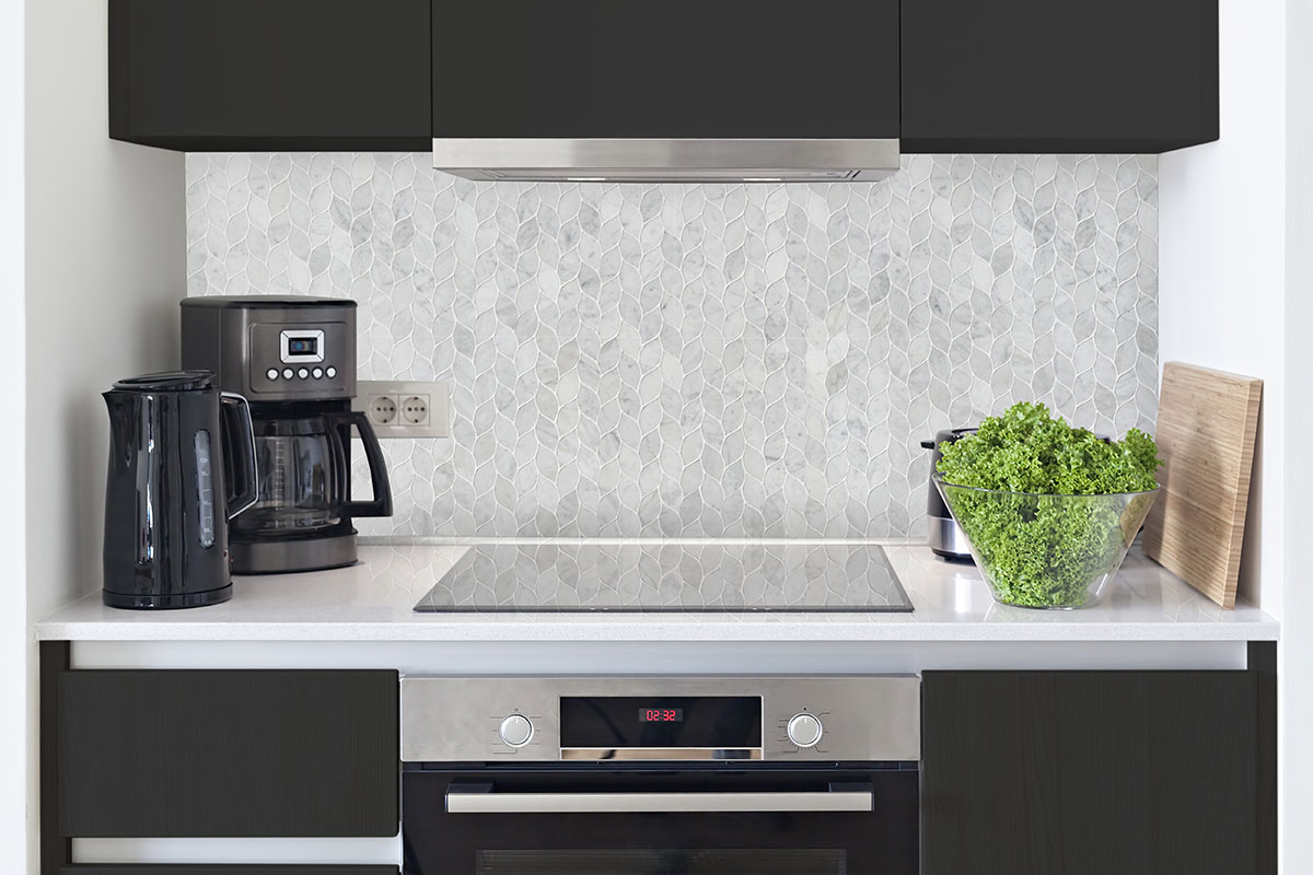 Carrara White Blanco Pattern Honed Tile backsplash in a kitchen — view 2