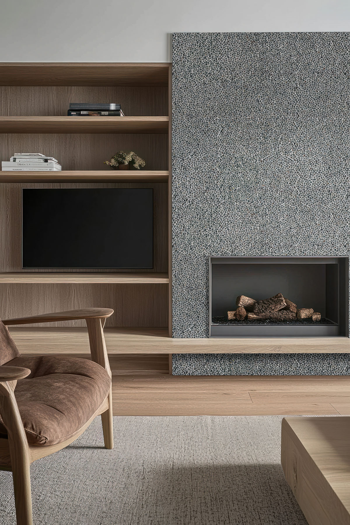 Noir Ash Mini Pebble backsplash in a living room