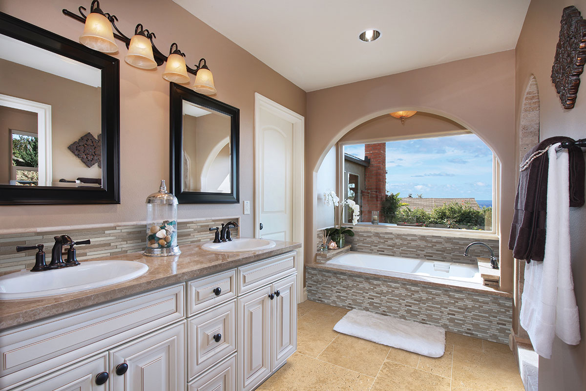 Ivory Travertine 3/4x3/4x12 Honed Pencil Molding backsplash in a bathroom